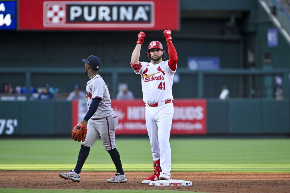 Jun 24, 2024; St. Louis, Missouri, USA;  St. Louis Cardinals first baseman Alec Burleson (41) reacts after hitting a one run double against the Atlanta Braves during the third inning at Busch Stadium. Mandatory Credit: Jeff Curry-USA TODAY Sports