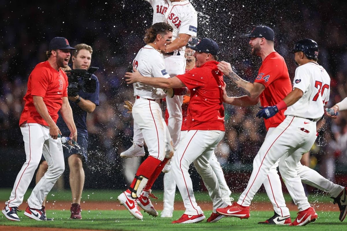 Jun 24, 2024; Boston, Massachusetts, USA; Boston Red Sox left fielder Jarren Duran (16) celebrates with teammates after hitting a game winning RBI single during the ninth inning against the Toronto Blue Jays at Fenway Park. Mandatory Credit: Paul Rutherford-USA TODAY Sports