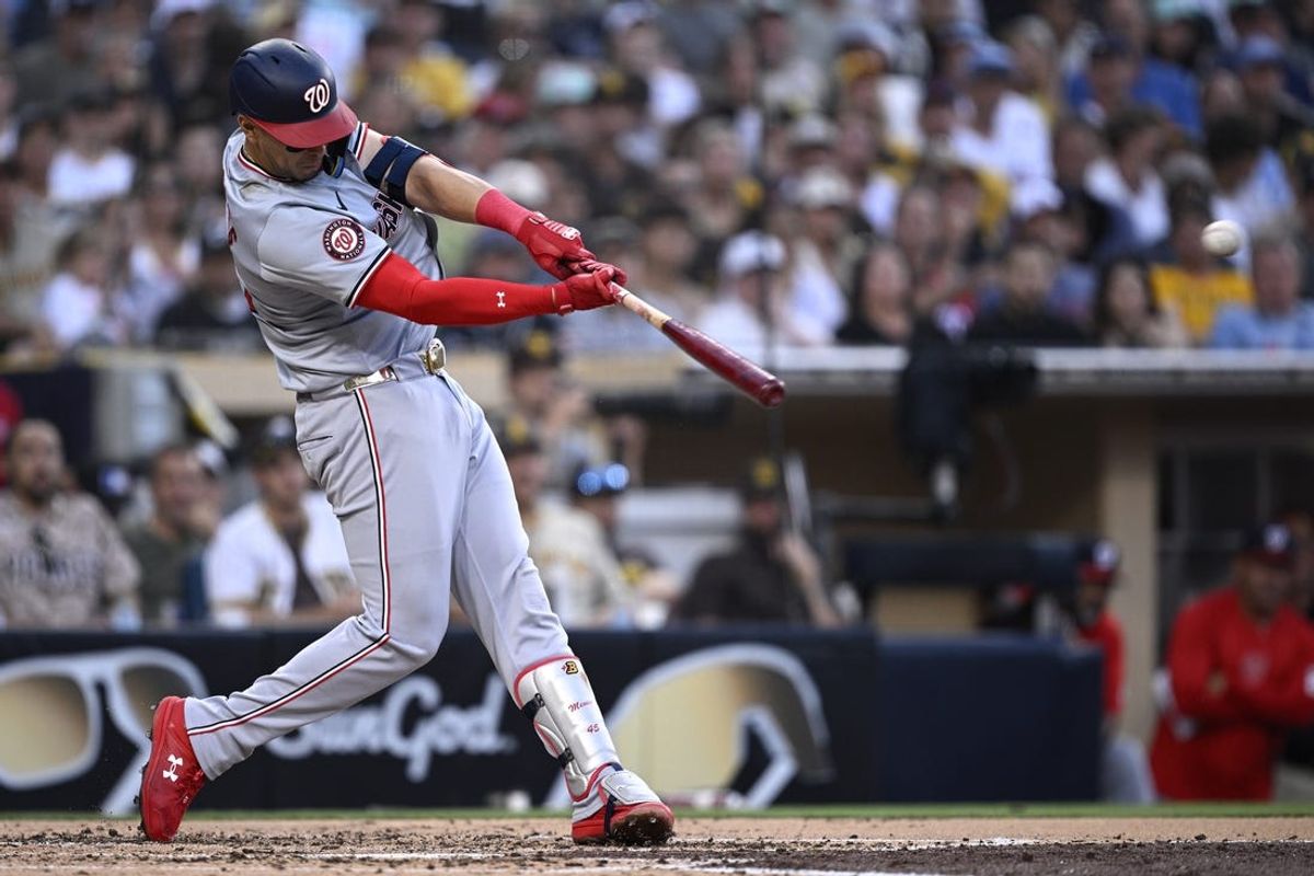 Jun 24, 2024; San Diego, California, USA; Washington Nationals first baseman Joey Meneses (45) hits an RBI double against the San Diego Padres during the third inning at Petco Park. Mandatory Credit: Orlando Ramirez-USA TODAY Sports