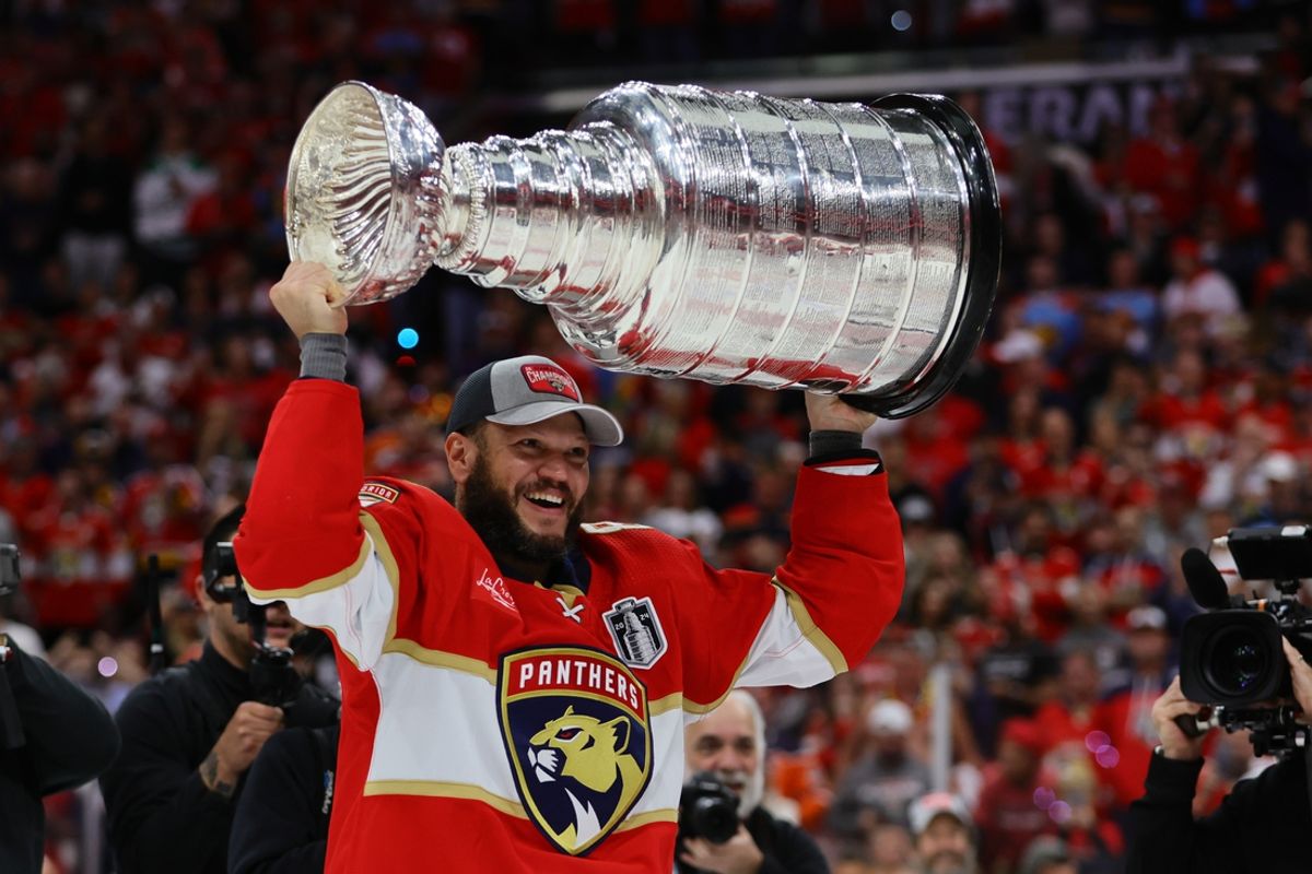 Jun 24, 2024; Sunrise, Florida, USA; Florida Panthers forward Kyle Okposo (8) hoists the Stanley Cup after defeating the Edmonton Oilers in game seven of the 2024 Stanley Cup Final at Amerant Bank Arena. Mandatory Credit: Sam Navarro-Imagn Images