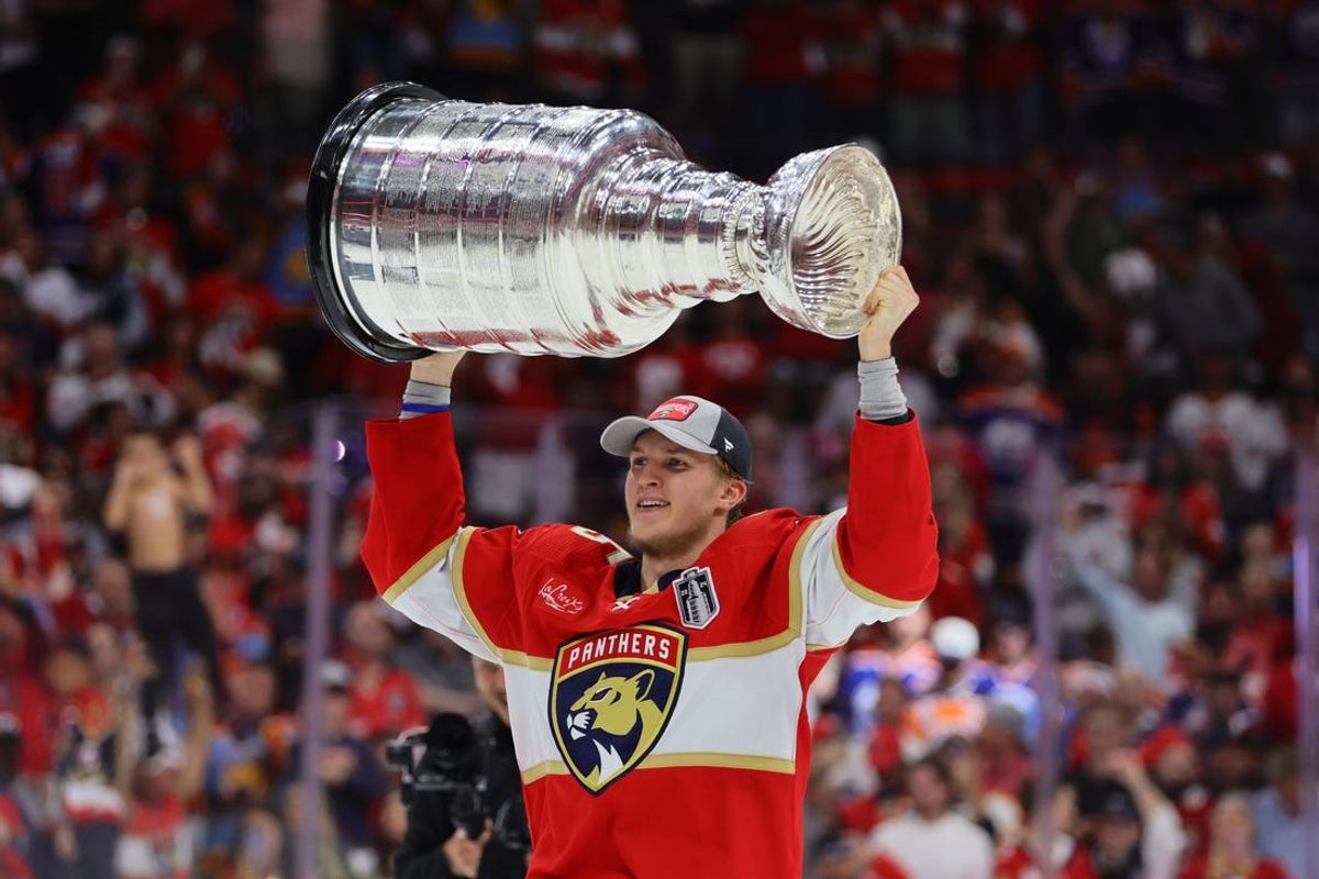 Jun 24, 2024; Sunrise, Florida, USA; Florida Panthers forward Anton Lundell (15) hoists the Stanley Cup after defeating the Edmonton Oilers in game seven of the 2024 Stanley Cup Final at Amerant Bank Arena. Mandatory Credit: Sam Navarro-USA TODAY Sports
