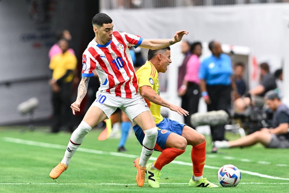 Jun 24, 2024; Houston, TX, USA; Paraguay midfielder Miguel Almiron (10, stripes) battles for the ball. Mandatory Credit: Maria Lysaker-Imagn Images