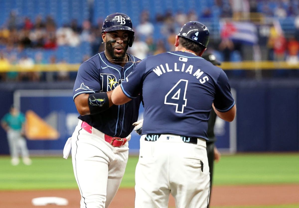 Jun 25, 2024; St. Petersburg, Florida, USA; Tampa Bay Rays first base Yandy Díaz (2) is congratulated by third base coach Brady Williams (4) hitting a home run against the Seattle Mariners during the first inning at Tropicana Field. Mandatory Credit: Kim Klement Neitzel-USA TODAY Sports