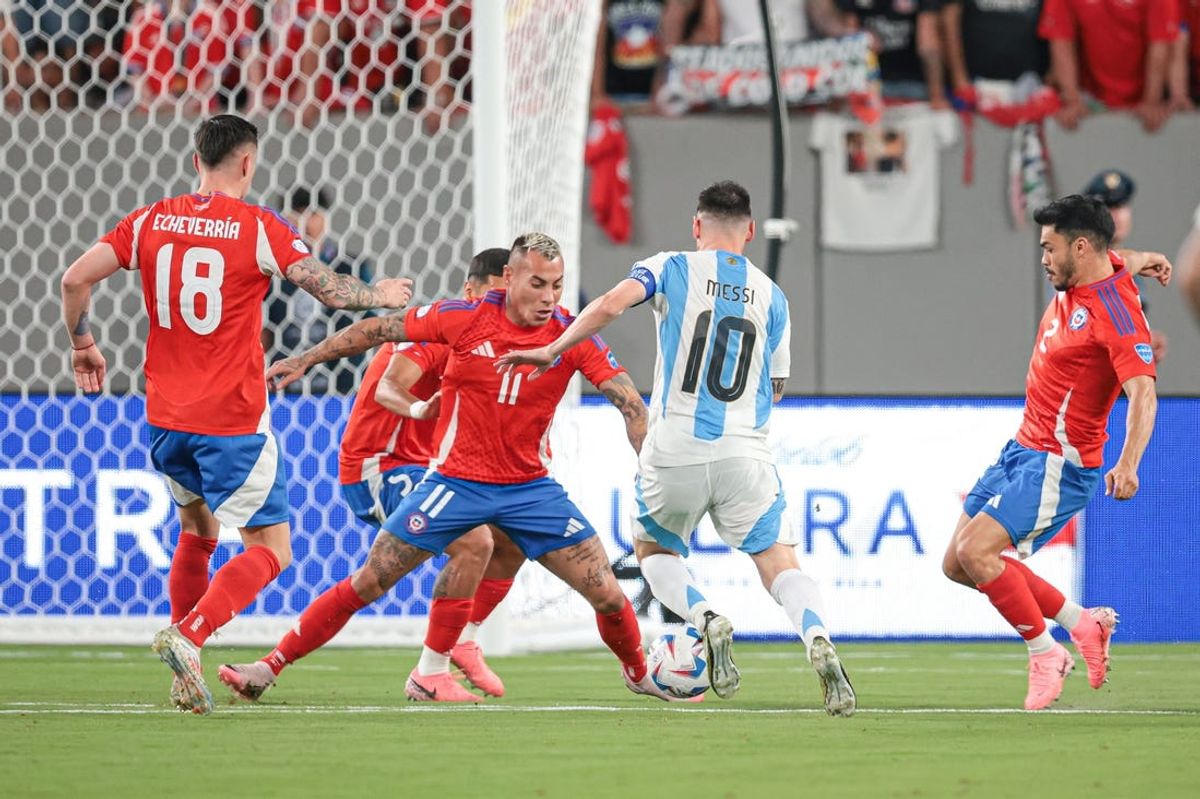 Jun 25, 2024; East Rutherford, NJ, USA; Chile forward Eduardo Vargas (11) defends against Argentina forward Lionel Messi (10) during the first half at MetLife Stadium. Mandatory Credit: Vincent Carchietta-USA TODAY Sports