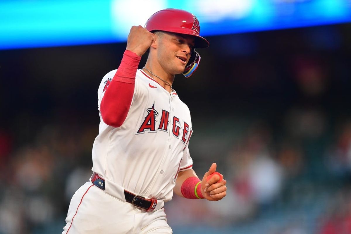 Jun 25, 2024; Anaheim, California, USA; Los Angeles Angels catcher Logan O'Hoppe (14) reacts after center fielder Mickey Moniak (16) hits a grand slam home run against the Oakland Athletics during the fourth inning at Angel Stadium. Mandatory Credit: Gary A. Vasquez-USA TODAY Sports