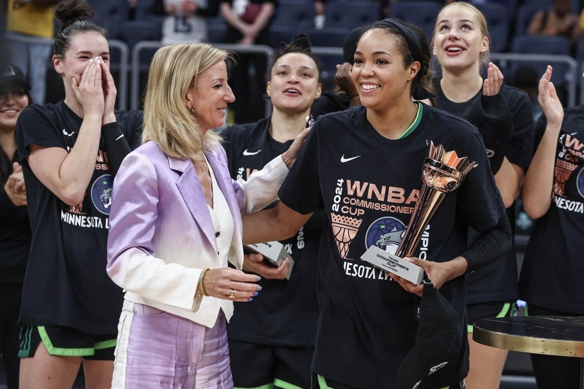 Jun 25, 2024; Belmont Park, New York, USA; WNBA Commissioner Cathy Englebert gives the WNBA Commissioner’s Cup Championship MVP award to Minnesota Lynx forward Napheesa Collier (24) at UBS Arena. Mandatory Credit: Wendell Cruz-Imagn Images