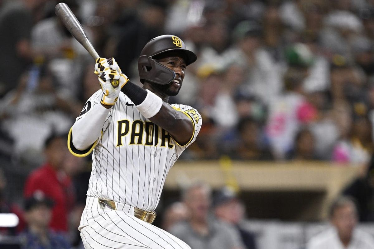 Jun 25, 2024; San Diego, California, USA; San Diego Padres left fielder Jurickson Profar (10) hits a grand slam against the Washington Nationals during the sixth inning at Petco Park. Mandatory Credit: Orlando Ramirez-USA TODAY Sports
