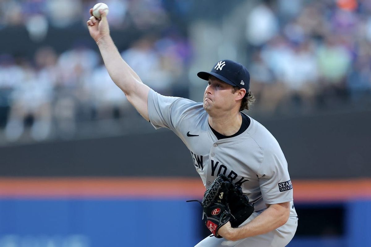 Jun 25, 2024; New York City, New York, USA; New York Yankees starting pitcher Gerrit Cole (45) pitches against the New York Mets during the first inning at Citi Field. Mandatory Credit: Brad Penner-USA TODAY Sports