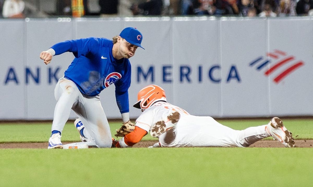 Jun 25, 2024; San Francisco, California, USA; Chicago Cubs shortstop Dansby Swanson (7) tags San Francisco Giants second baseman Thairo Estrada (39) out in a failed steal attempt during the seventh inning at Oracle Park. Mandatory Credit: John Hefti-USA TODAY Sports