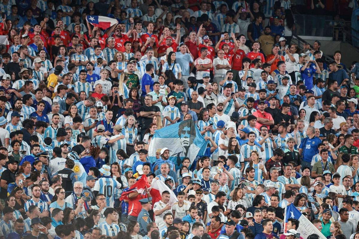 Jun 25, 2024; East Rutherford, NJ, USA; Argentina fans hold a banner of soccer legend Diego Maradona before the match against Chile at MetLife Stadium. Mandatory Credit: Vincent Carchietta-Imagn Images