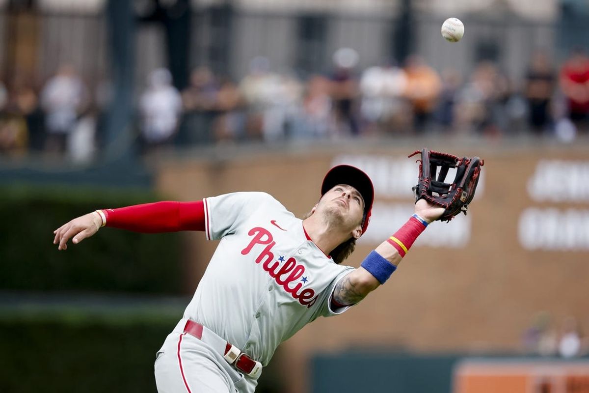 Jun 26, 2024; Detroit, Michigan, USA;  Philadelphia Phillies second baseman Bryson Stott (5) catches a fly ball against the Detroit Tigers in the second inning at Comerica Park. Mandatory Credit: Rick Osentoski-USA TODAY Sports