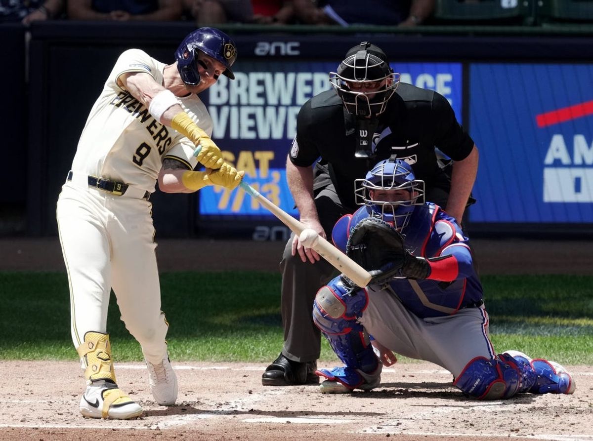 Milwaukee Brewers first baseman Jake Bauers (9) hits a grand slam home run off of Texas Rangers pitcher Nathan Eovaldi during the third inning of their game Wednesday, June 26, 2024 at American Family Field in Milwaukee, Wisconsin.