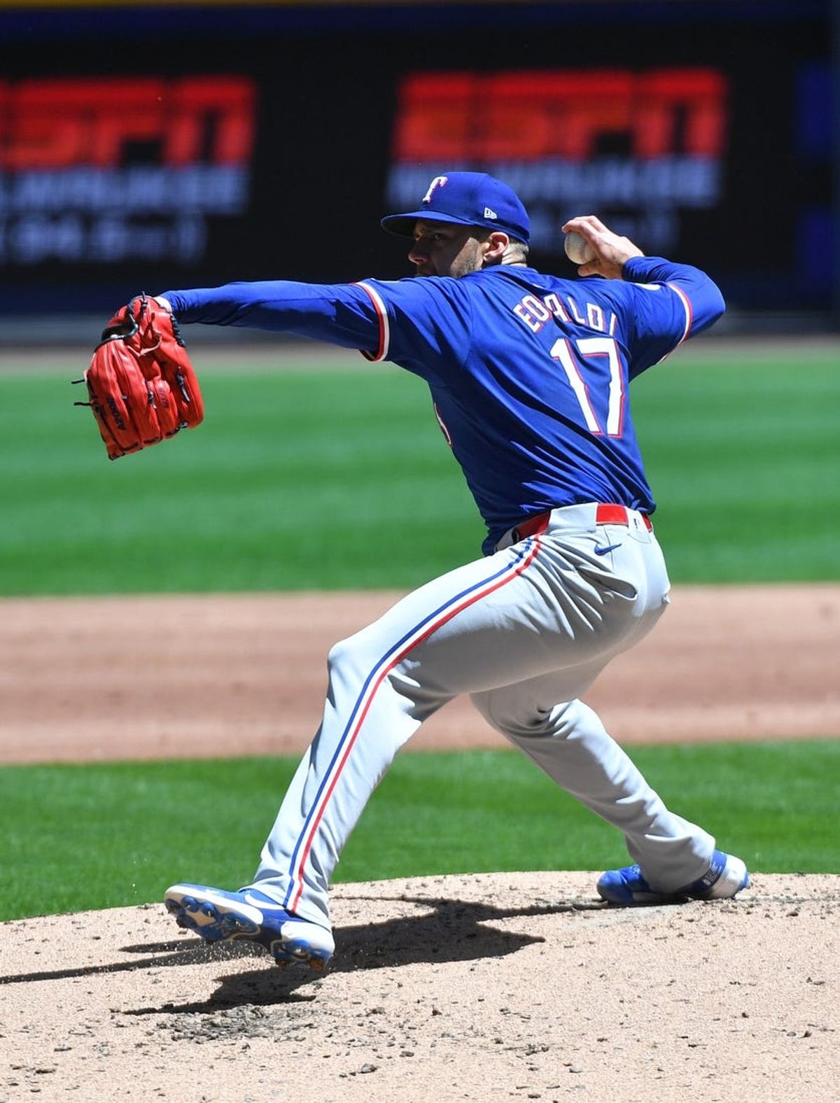 Jun 26, 2024; Milwaukee, Wisconsin, USA; Texas Rangers pitcher Nathan Eovaldi (17) delivers against the Milwaukee Brewers in the first inning at American Family Field. Mandatory Credit: Michael McLoone-USA TODAY Sports