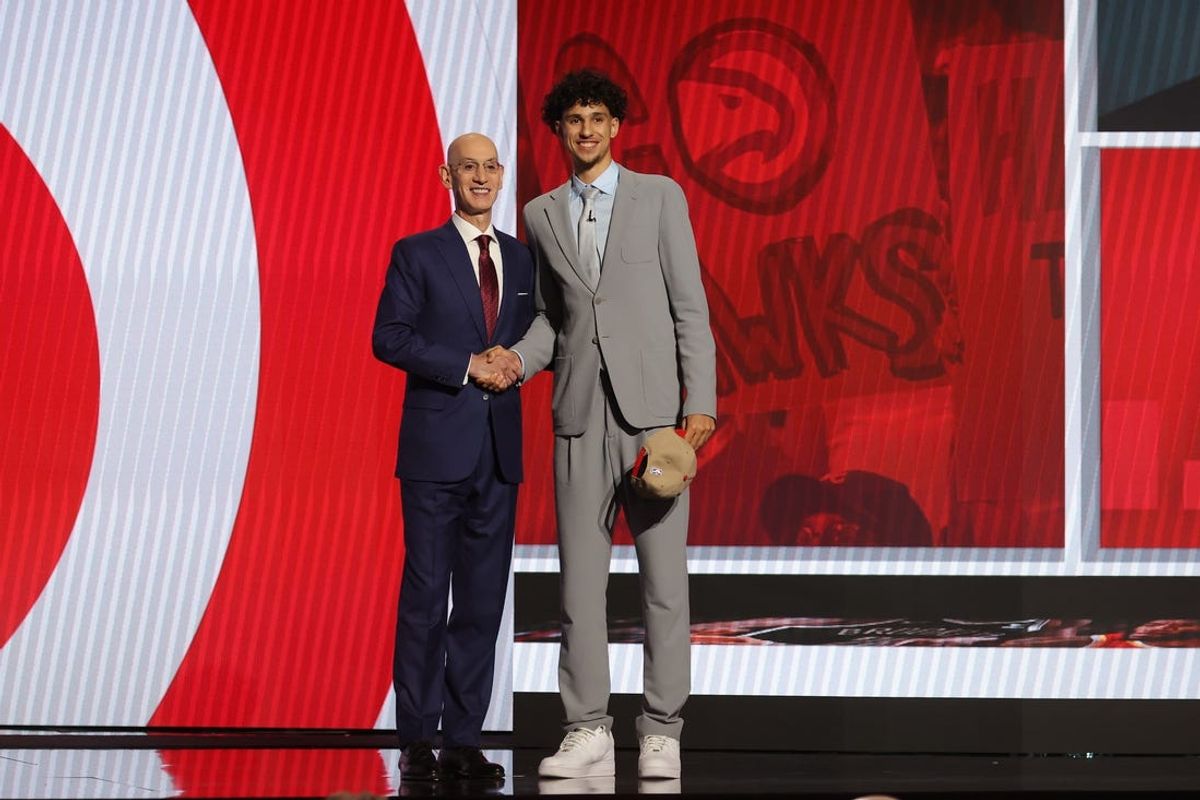 Jun 26, 2024; Brooklyn, NY, USA; Zaccharie Risacher poses for photos with NBA commissioner Adam Silver after being selected first overall by the Atlanta Hawks in the first round of the 2024 NBA Draft at Barclays Center. Mandatory Credit: Brad Penner-USA TODAY Sports