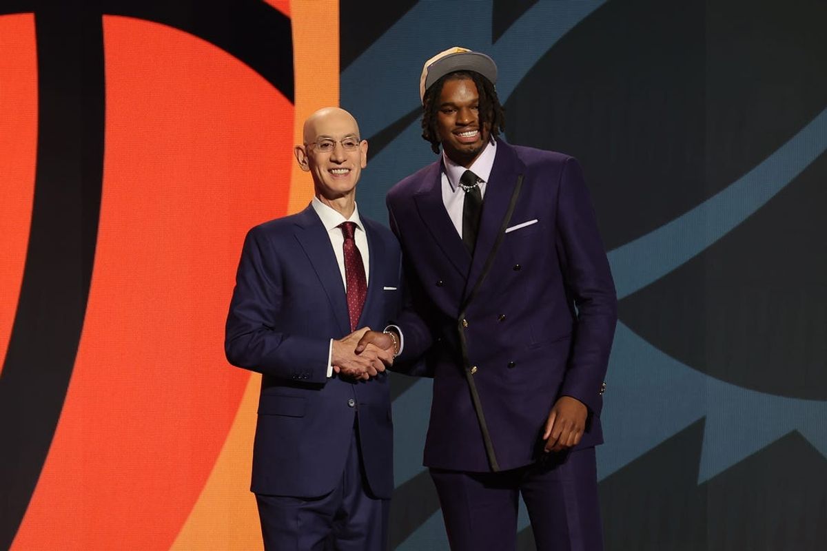 Jun 26, 2024; Brooklyn, NY, USA; DaRon Holmes ll poses for photos with NBA commissioner Adam Silver after being selected in the first round by the Phoenix Suns in the 2024 NBA Draft at Barclays Center. Mandatory Credit: Brad Penner-USA TODAY Sports