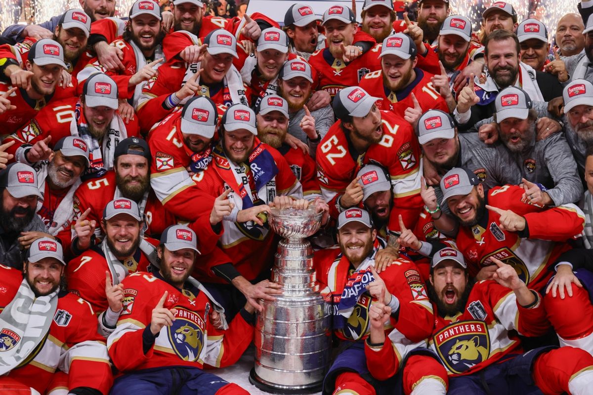 Jun 24, 2024; Sunrise, Florida, USA; The Florida Panthers pose with the cup for a team photo after winning game seven of the 2024 Stanley Cup Final against the Edmonton Oilers at Amerant Bank Arena. Mandatory Credit: Sam Navarro-Imagn Images