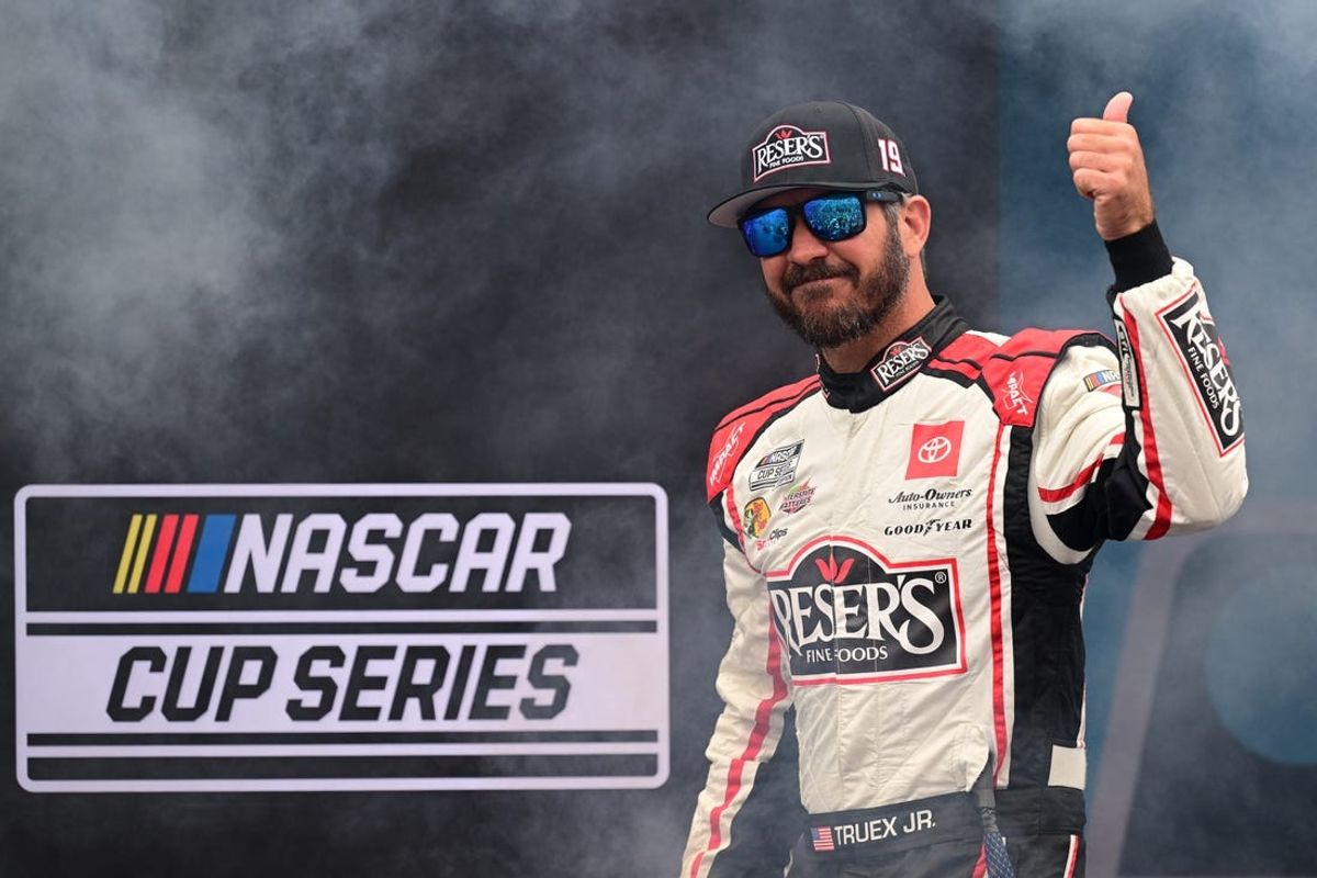 Jun 23, 2024; Loudon, New Hampshire, USA; NASCAR Cup Series driver Martin Truex Jr. (19)  is introduced before the start of the USA TODAY 301 at New Hampshire Motor Speedway. Mandatory Credit: Eric Canha-USA TODAY Sports