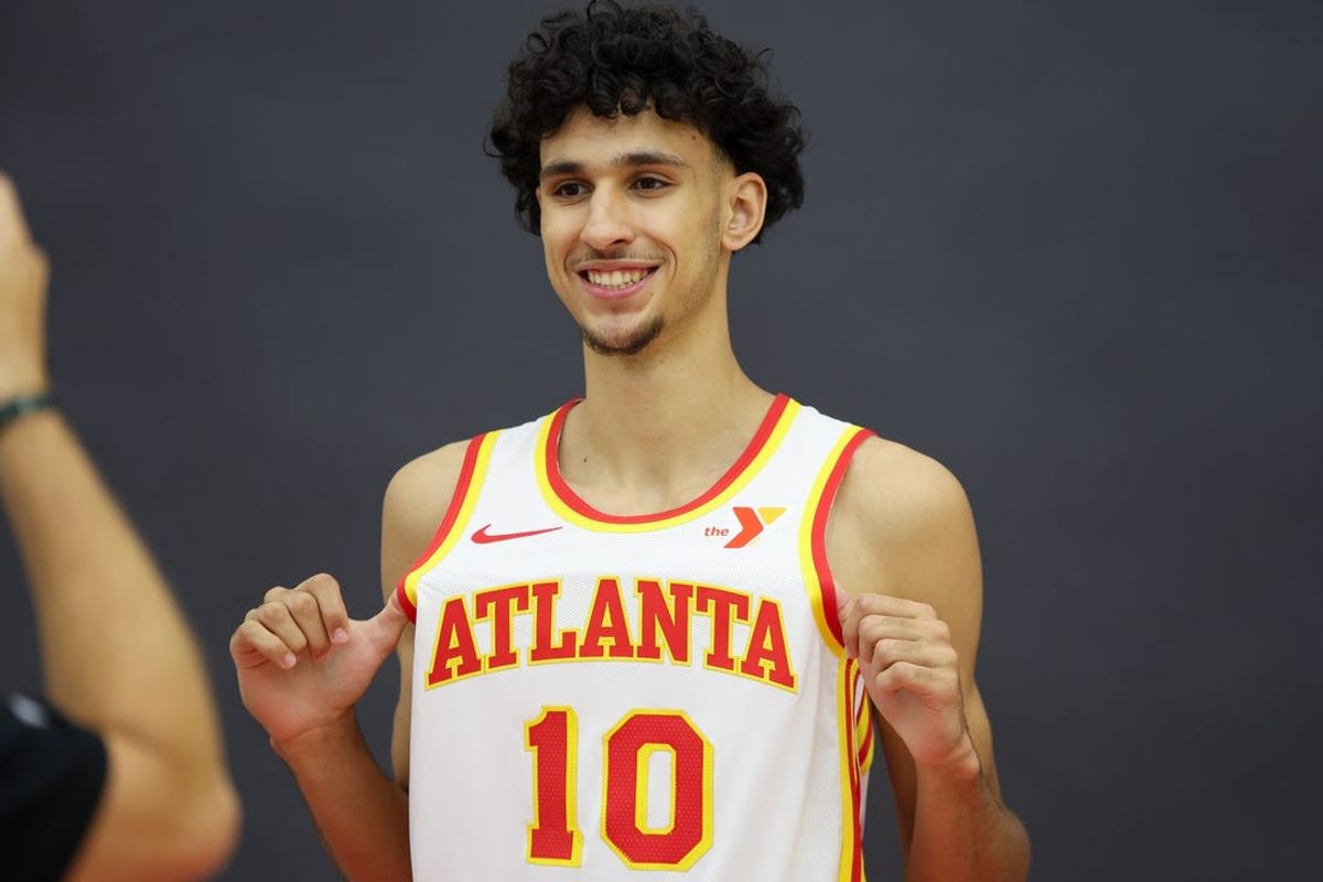 Jun 28, 2024; Atlanta, Georgia, USA; Atlanta Hawks first overall draft pick Zaccharie Risacher (10) poses for a photo at the Emory Sports Medicine Complex. Mandatory Credit: Brett Davis-USA TODAY Sports