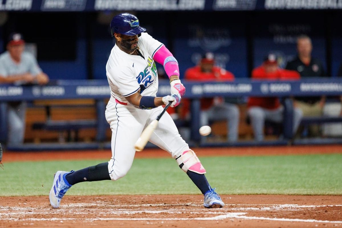 Jun 28, 2024; St. Petersburg, Florida, USA;  Tampa Bay Rays first base Yandy Diaz (2) hits a base hit against the Washington Nationals in the third inning at Tropicana Field. Mandatory Credit: Nathan Ray Seebeck-USA TODAY Sports