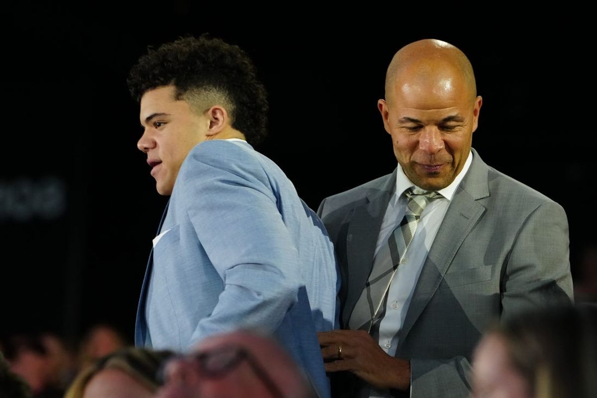 Jun 28, 2024; Las Vegas, Nevada, USA; Tij Iginla alongside father and NHL Hall of Fame player Jarome Iginla is selected with the 6th overall pick of the first round of the 2024 NHL Draft by the Utah Hockey Club at The Sphere. Mandatory Credit: Stephen R. Sylvanie-USA TODAY Sports