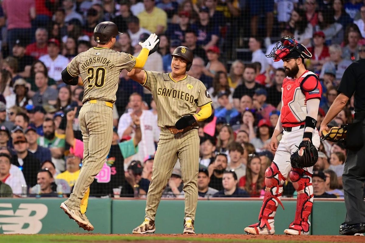 Jun 28, 2024; Boston, Massachusetts, USA; San Diego Padres catcher Kyle Higashioka (20) celebrates his two-run home run with shortstop Ha-Seong Kim (7) during the fifth inning against the Boston Red Sox at Fenway Park. Mandatory Credit: Eric Canha-USA TODAY Sports