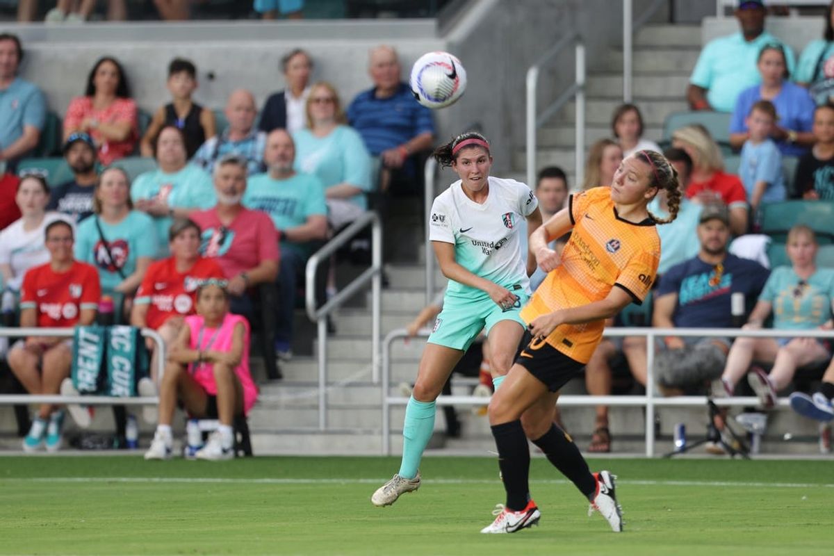 Jun 28, 2024; Kansas City, Missouri, USA; Kansas City Current defender Isabel Rodriguez (18) plays the ball in the first half against the Houston Dash at CPKC Stadium. Mandatory Credit: William Purnell-USA TODAY Sports