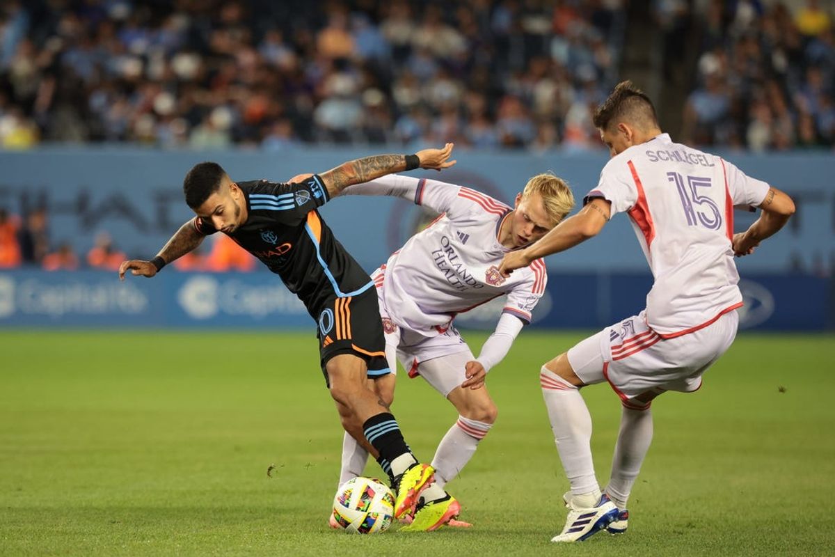 Jun 28, 2024; New York, New York, USA; New York City FC midfielder Santiago Rodriguez (10) battles Orlando City midfielder Dagur Dan Thorhallsson (17) and defender Rodrigo Schlegel (15) for the ball in the second half at Yankee Stadium. Mandatory Credit: Vincent Carchietta-USA TODAY Sports