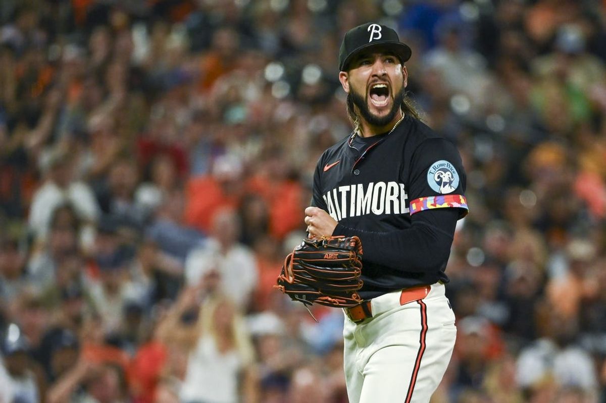 Jun 28, 2024; Baltimore, Maryland, USA;  Baltimore Orioles pitcher Cionel Pérez (58) reacts after pitching the eighth inning against the Texas Rangersat Oriole Park at Camden Yards. Mandatory Credit: Tommy Gilligan-USA TODAY Sports