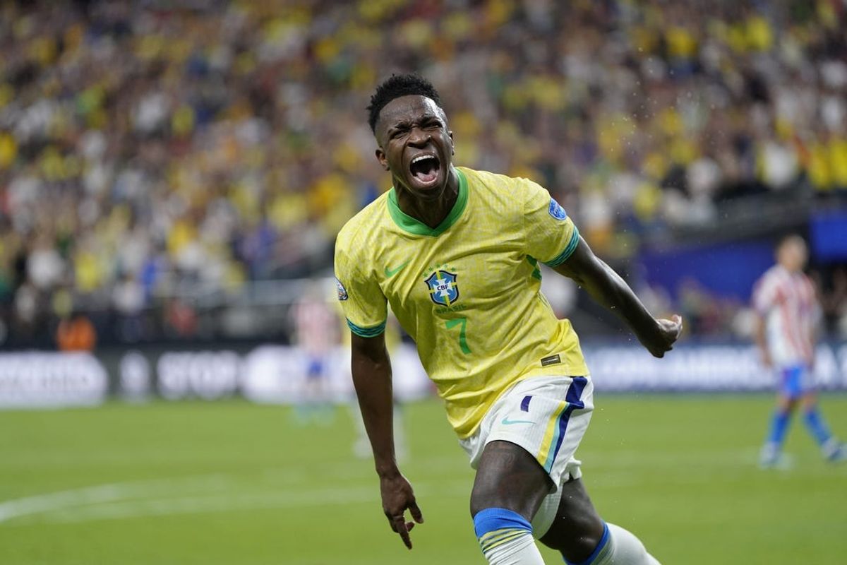 Jun 28, 2024; Las Vegas, NV, USA;  Brazil forward Vinicius Junior (7) reacts after scoring a goal against Paraguay during the first half at Allegiant Stadium. Mandatory Credit: Lucas Peltier-USA TODAY Sports