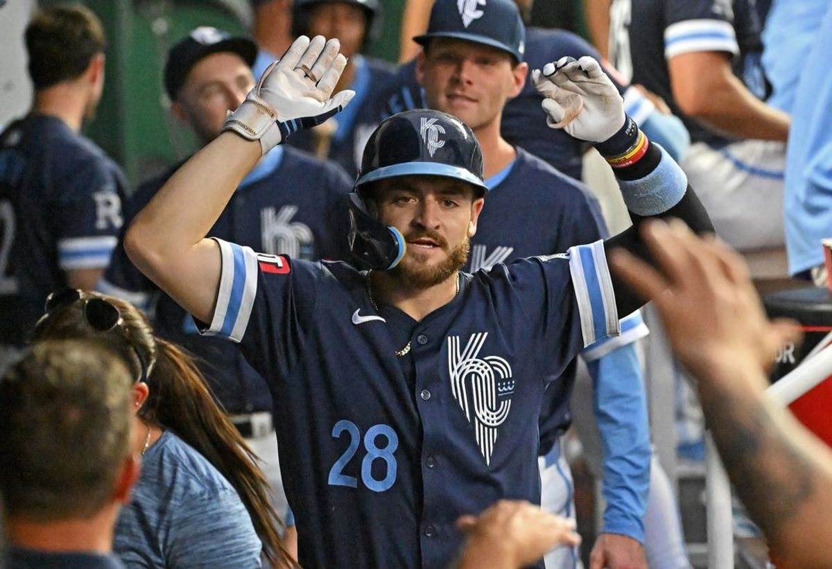 Jun 28, 2024; Kansas City, Missouri, USA;  Kansas City Royals center fielder Kyle Isbel (28) celebrates in the dugout after hitting a solo home run in the fourth inning against the Cleveland Guardians at Kauffman Stadium. Mandatory Credit: Peter Aiken-USA TODAY Sports
