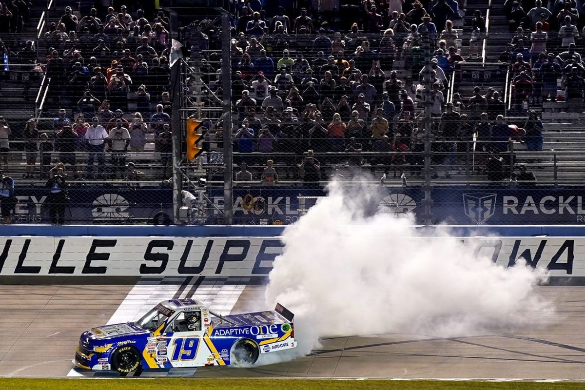 NASCAR Truck Series driver Christian Eckes does a burnout after winning the Rackley Roofing 200 at Nashville Superspeedway in Lebanon, Tenn., Friday, June 28, 2024.