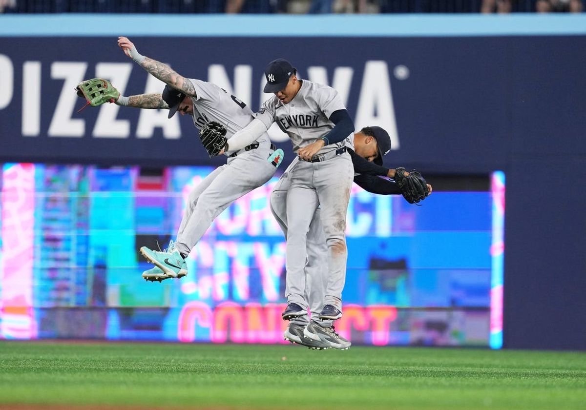 Jun 28, 2024; Toronto, Ontario, CAN; New York Yankees left fielder Alex Verdugo (24) celebrates a win with right fielder Juan Soto (22) against the Toronto Blue Jays at Rogers Centre. Mandatory Credit: Nick Turchiaro-USA TODAY Sports