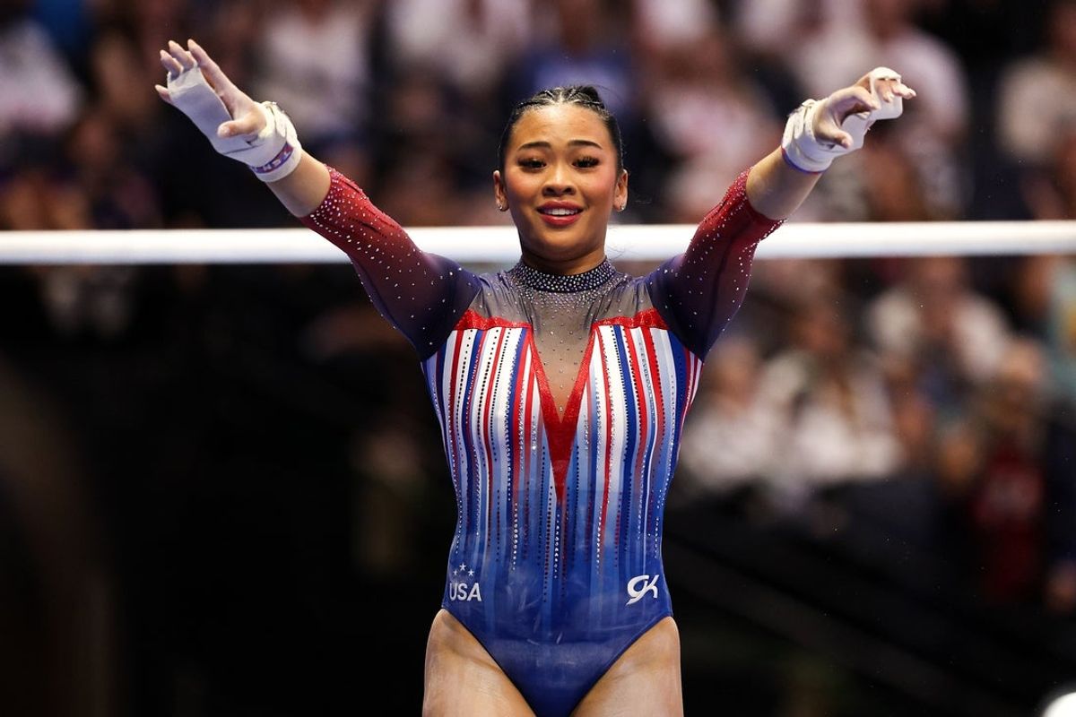 Jun 28, 2024; Minneapolis, Minnesota, USA; Sunisa Lee celebrates her uneven bars routine during the U.S. Olympic Team Gymnastics Trials at Target Center. Mandatory Credit: Matt Krohn-Imagn Images
