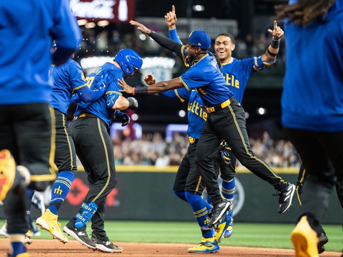 Jun 28, 2024; Seattle, Washington, USA; Seattle Mariners including Cal Raleigh (29), third from left, Ryan Bliss (1), third from right, and Julio Rodriguez (44), second from right, celebrate after a game against the Minnesota Twins at T-Mobile Park. Mandatory Credit: Stephen Brashear-USA TODAY Sports