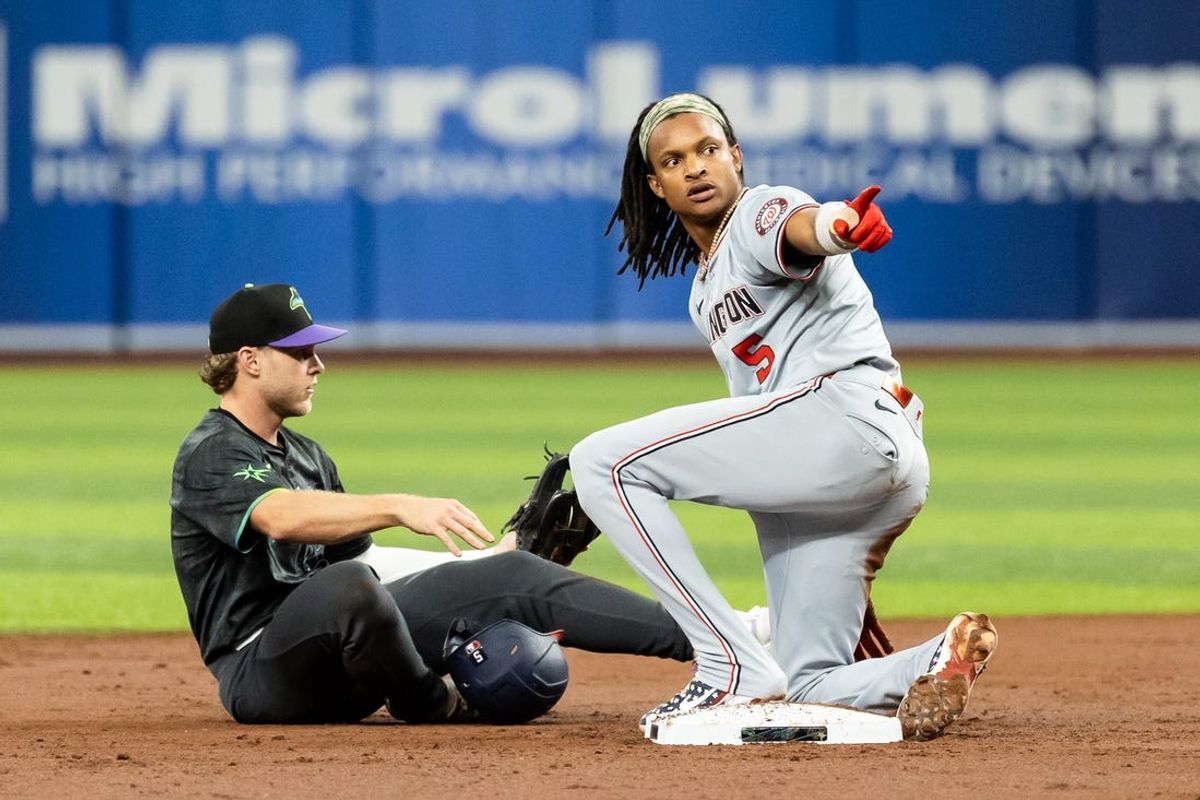 Jun 29, 2024; St. Petersburg, Florida, USA; Washington Nationals shortstop CJ Abrams (5) gestures toward umpire Phil Cuzzi (10) against the Tampa Bay Rays during the third inning at Tropicana Field. Mandatory Credit: Matt Pendleton-USA TODAY Sports