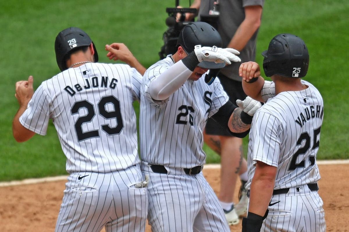 Jun 29, 2024; Chicago, Illinois, USA; Chicago White Sox catcher Korey Lee (26) celebrates with shortstop Paul DeJong (29) first base Andrew Vaughn (25) after hitting a three-run home run during the eighth inning against the Colorado Rockies at Guaranteed Rate Field. Mandatory Credit: Patrick Gorski-USA TODAY Sports