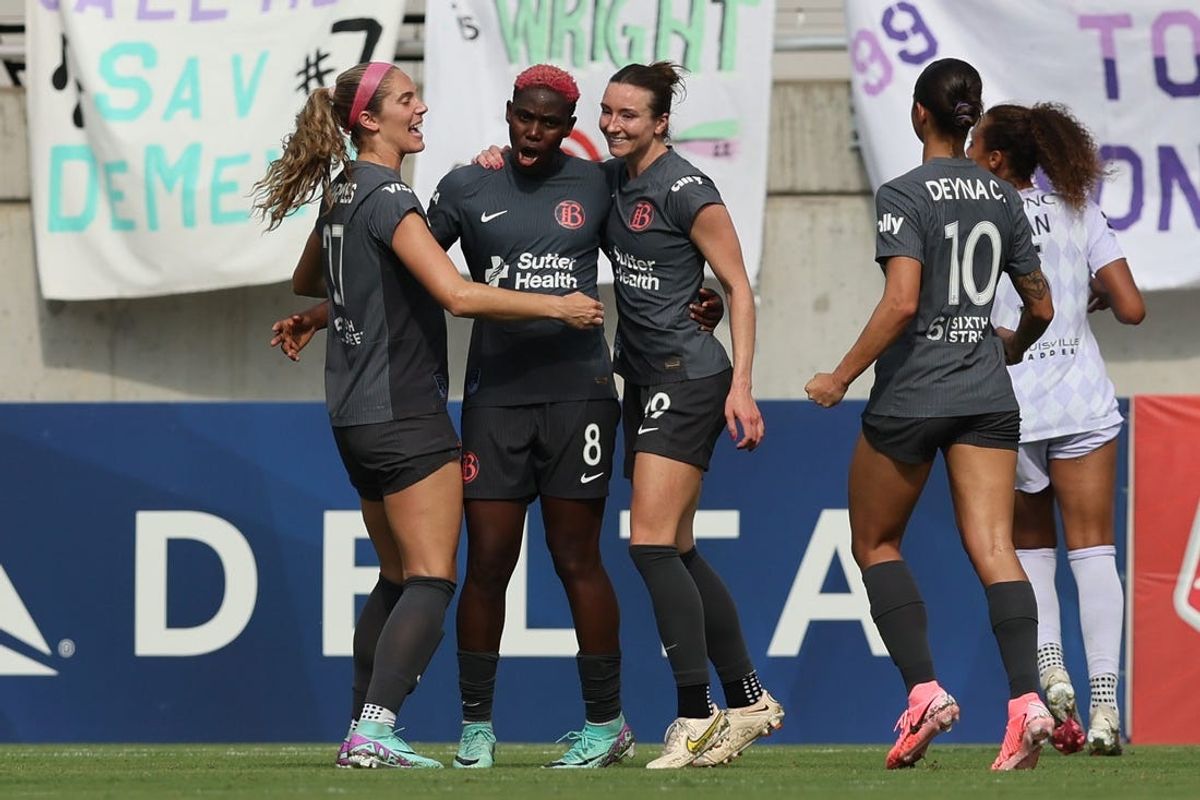 Jun 29, 2024; Louisville, Kentucky, USA; Bay FC forward Asisat Oshoala (8) celebrates with defender Kayla Sharples (27) and midfielder Dorian Bailey (19) and midfielder Deyna Castellanos (10) after scoring a goal against Racing Louisville FC during the second half at Lynn Family Stadium. Mandatory Credit: EM Dash-USA TODAY Sports