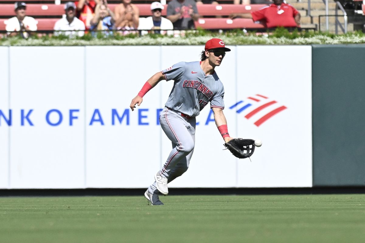 Jun 29, 2024; St. Louis, Missouri, USA; Cincinnati Reds outfielder Stuart Fairchild (17) fields a ball form St. Louis Cardinals second baseman Nolan Gorman (16) during the eighth inning at Busch Stadium. Mandatory Credit: Jeff Le-USA TODAY Sports