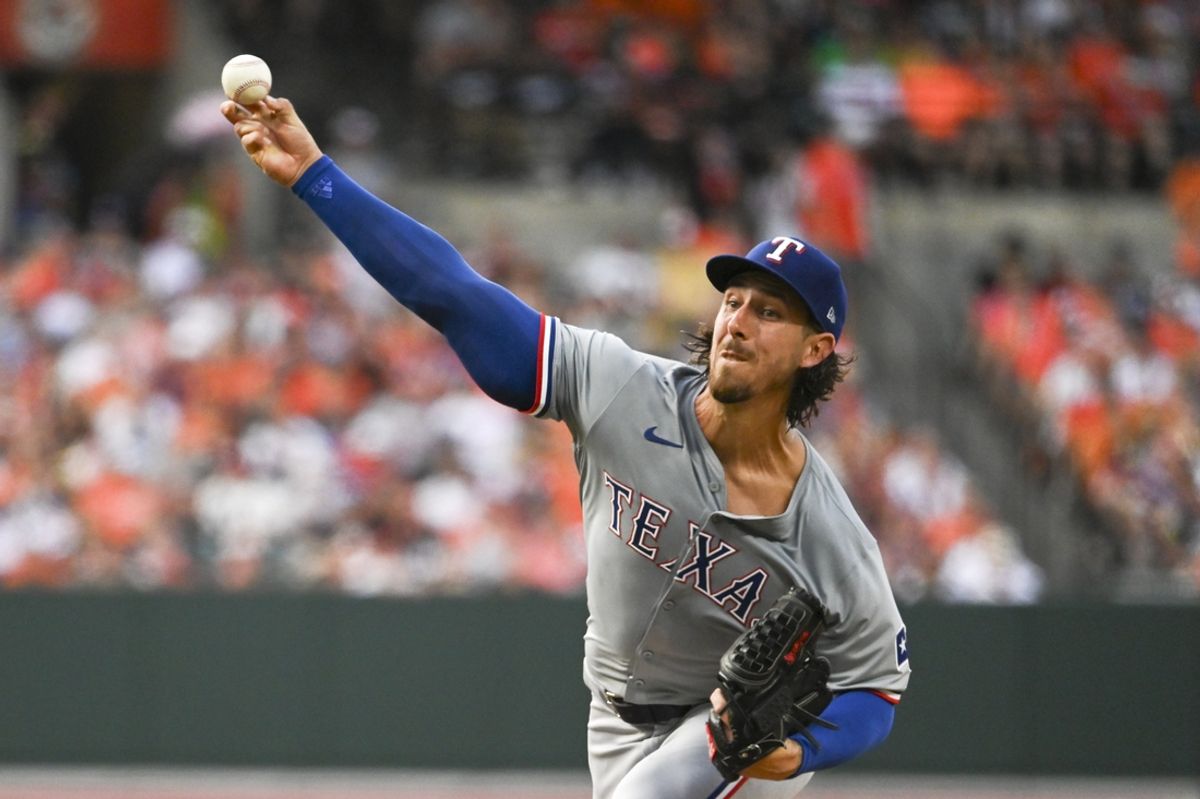 Jun 29, 2024; Baltimore, Maryland, USA;  Texas Rangers pitcher Michael Lorenzen (23) throws a first inning pitch against the Baltimore Orioles at Oriole Park at Camden Yards. Mandatory Credit: Tommy Gilligan-USA TODAY Sports