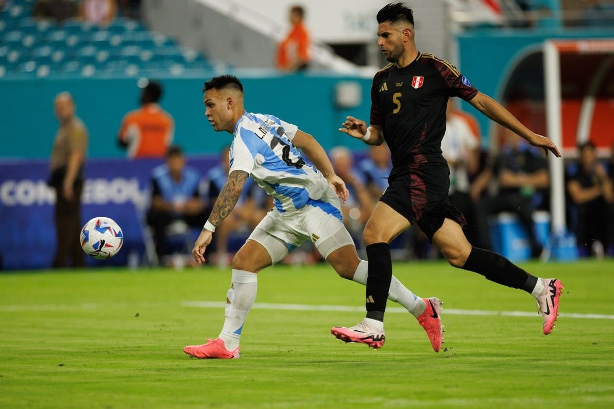 Jun 29, 2024; Miami, FL, USA;  forward Lautaro Martínez (22) scores a goal against Peru in the second half during the Copa America group stage at Hard Rock Stadium. Mandatory Credit: Nathan Ray Seebeck-USA TODAY Sports