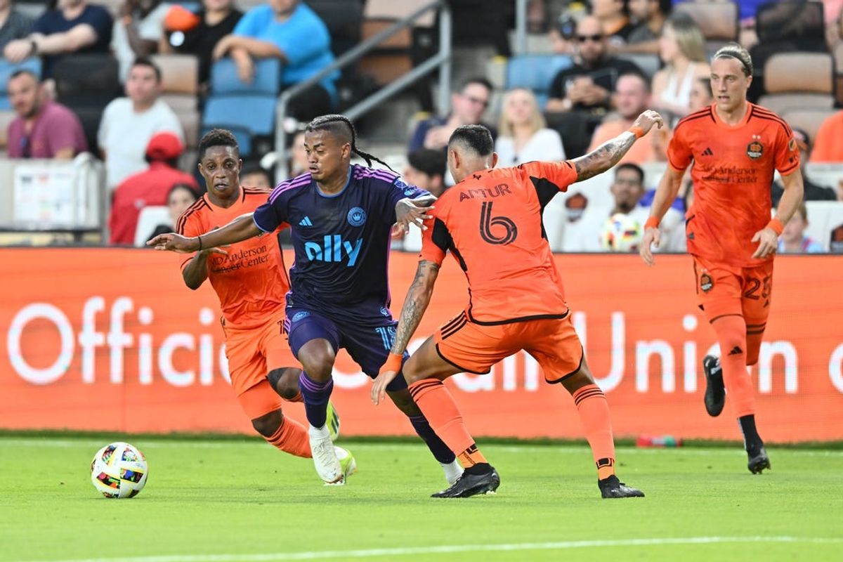 Jun 29, 2024; Houston, Texas, USA; Charlotte FC forward Kerwin Vargas (18) plays the ball defend by Houston Dynamo FC  midfielder Artur (6) in the first half at Shell Energy Stadium. Mandatory Credit: Maria Lysaker-USA TODAY Sports