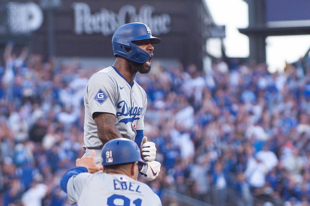 Jun 29, 2024; San Francisco, California, USA; Los Angeles Dodgers outfielder Jason Heyward (23) reacts after hitting a triple against the San Francisco Giants during the eleventh inning at Oracle Park. Mandatory Credit: Ed Szczepanski-USA TODAY Sports