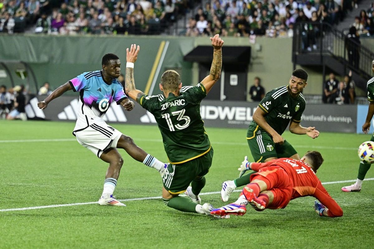 Jun 29, 2024; Portland, Oregon, USA; Minnesota United forward Bongokuhle Hlongwane (21) scores a goal in the first half against the Portland Timbers at Providence Park. Mandatory Credit: Troy Wayrynen-USA TODAY Sports