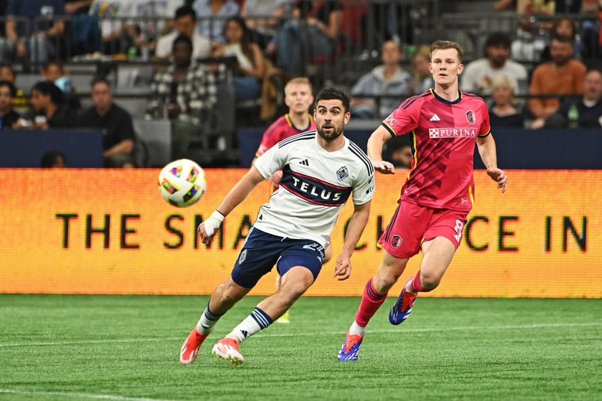Jun 29, 2024; Vancouver, British Columbia, CAN; Vancouver Whitecaps FC forward Brian White (24) and St. Louis City SC midfielder Chris Durkin (8) race after a loose ball during the second half at BC Place. Mandatory Credit: Simon Fearn-USA TODAY Sports