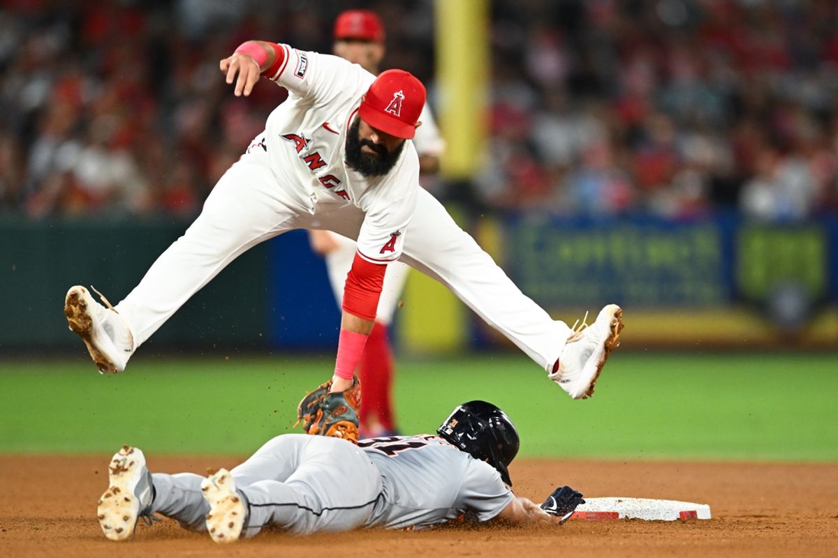 Jun 29, 2024; Anaheim, California, USA; Los Angeles Angels second base Luis Guillorme (15) tags Detroit Tigers outfielder Riley Greene (31) during the ninth inning at Angel Stadium. Mandatory Credit: Jonathan Hui-USA TODAY Sports
