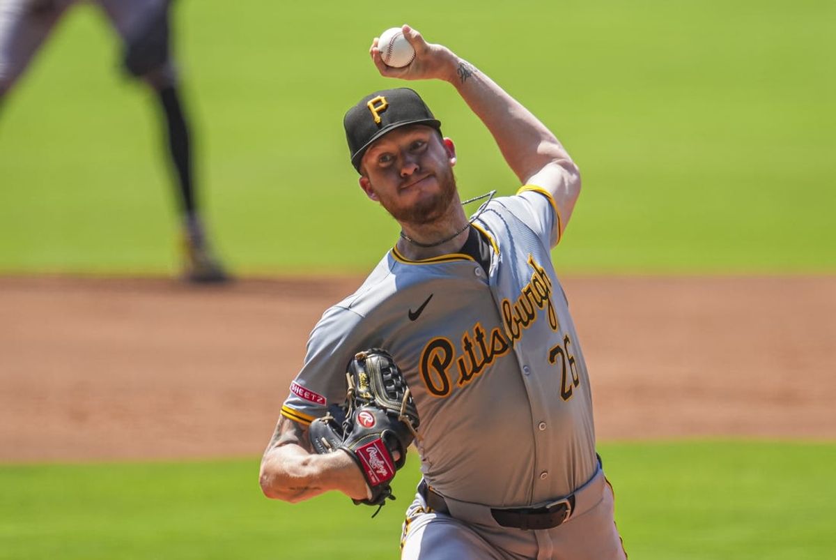 Jun 30, 2024; Cumberland, Georgia, USA; Pittsburgh Pirates starting pitcher Bailey Falter (26) pitches against the Atlanta Braves during the first inning at Truist Park. Mandatory Credit: Dale Zanine-USA TODAY Sports