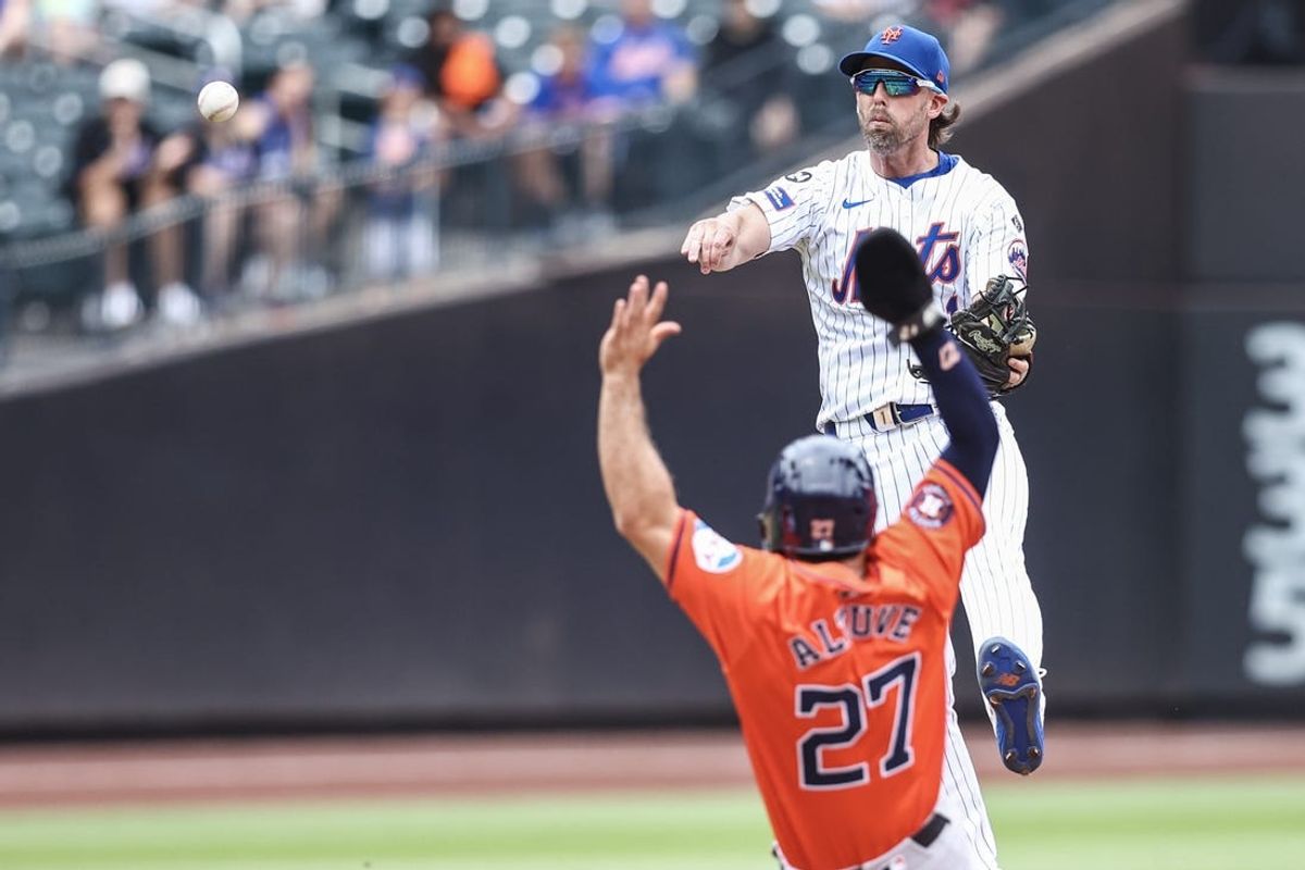 Jun 30, 2024; New York City, New York, USA;  New York Mets second baseman Jeff McNeil (1) throws past Houston Astros second baseman Jose Altuve (27) to complete a double play in the first inning at Citi Field. Mandatory Credit: Wendell Cruz-USA TODAY Sports