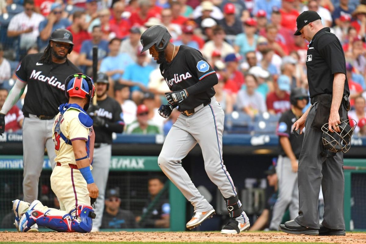 Jun 30, 2024; Philadelphia, Pennsylvania, USA; Miami Marlins outfielder Bryan De La Cruz (14) crosses home plate after hitting a home run against the Philadelphia Phillies during the third inning at Citizens Bank Park. Mandatory Credit: Eric Hartline-USA TODAY Sports