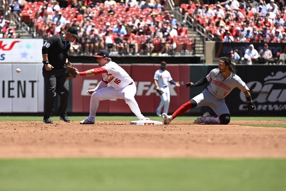 Jun 30, 2024; St. Louis, Missouri, USA; Cincinnati Reds second baseman Jonathan India (6) is safe from St. Louis Cardinals second baseman Nolan Gorman (16) after hitting a double during the third inning at Busch Stadium. Mandatory Credit: Jeff Le-USA TODAY Sports