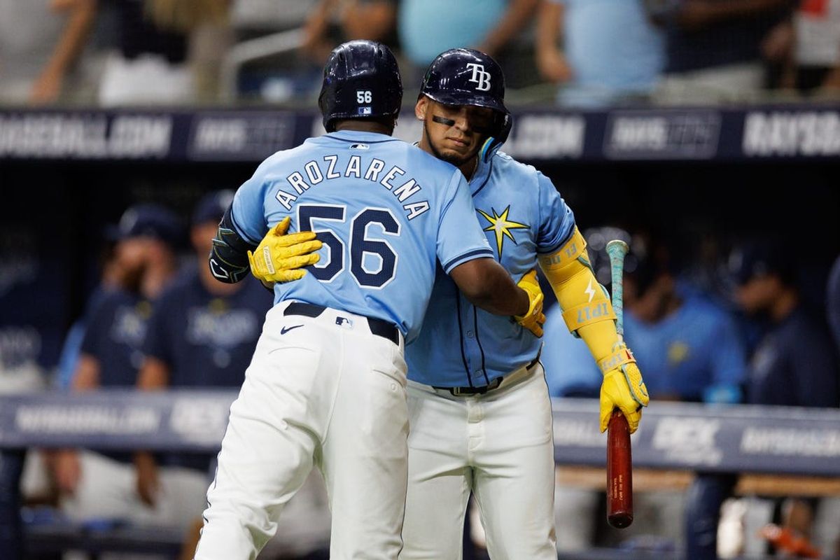 Jun 30, 2024; St. Petersburg, Florida, USA;  Tampa Bay Rays first baseman Isaac Paredes (17) congratulates outfielder Randy Arozarena (56) after hitting a home run against the Washington Nationals in the seventh inning at Tropicana Field. Mandatory Credit: Nathan Ray Seebeck-USA TODAY Sports